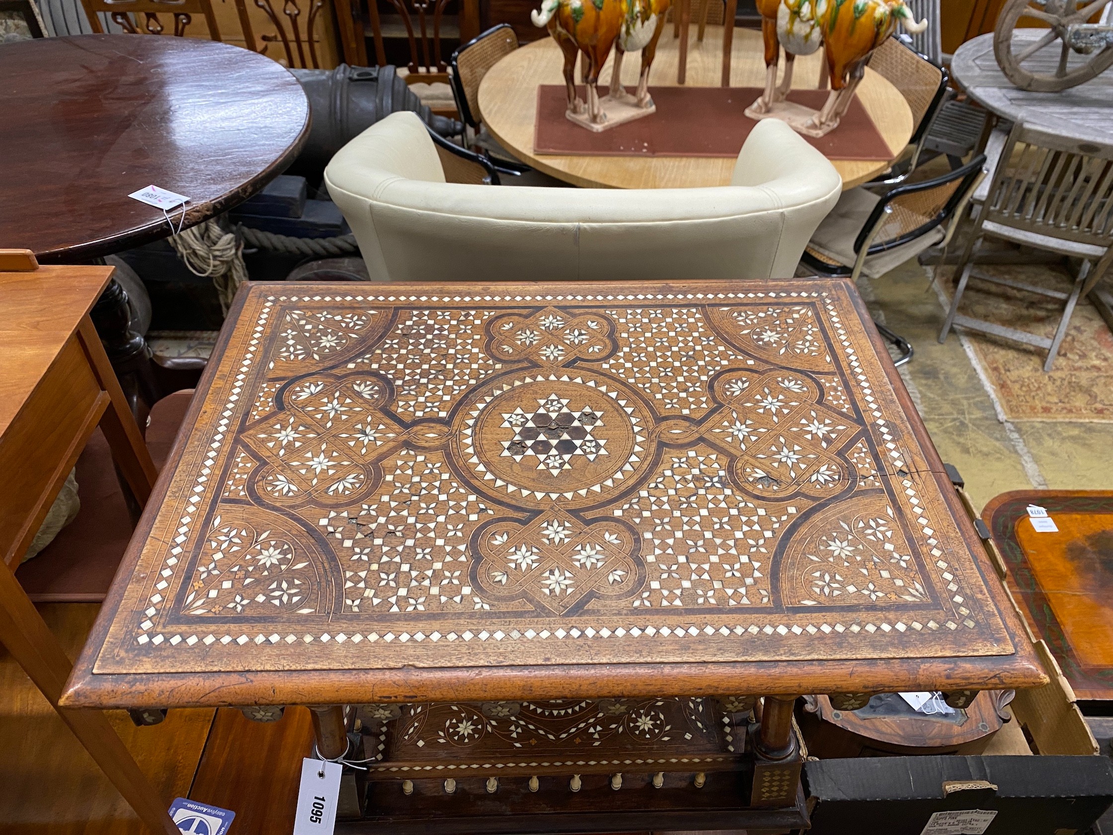 A Damascan bone inlaid two tier table, width 59cm, depth 44cm, height 76cm